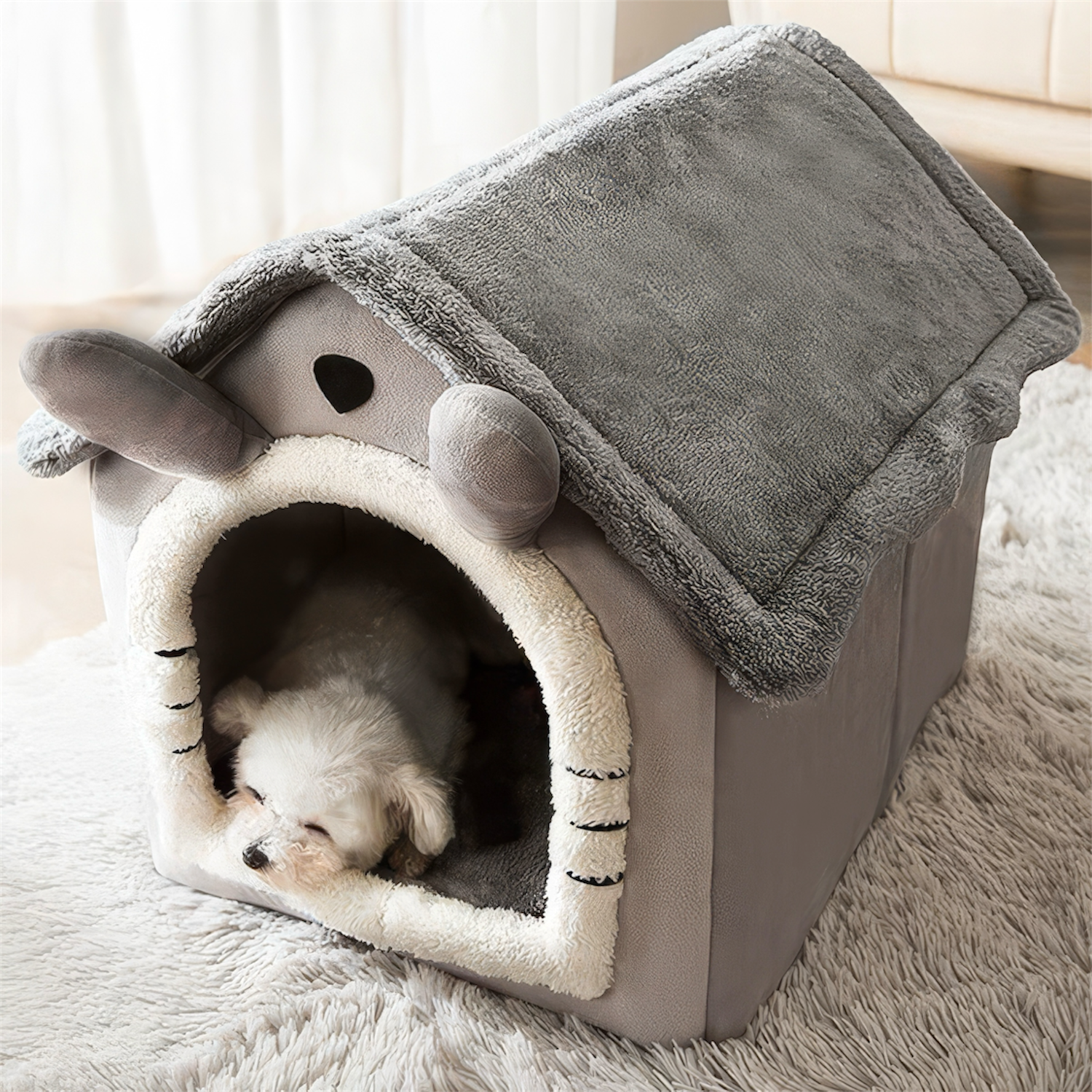 Pet house with a small dog inside on a soft surface